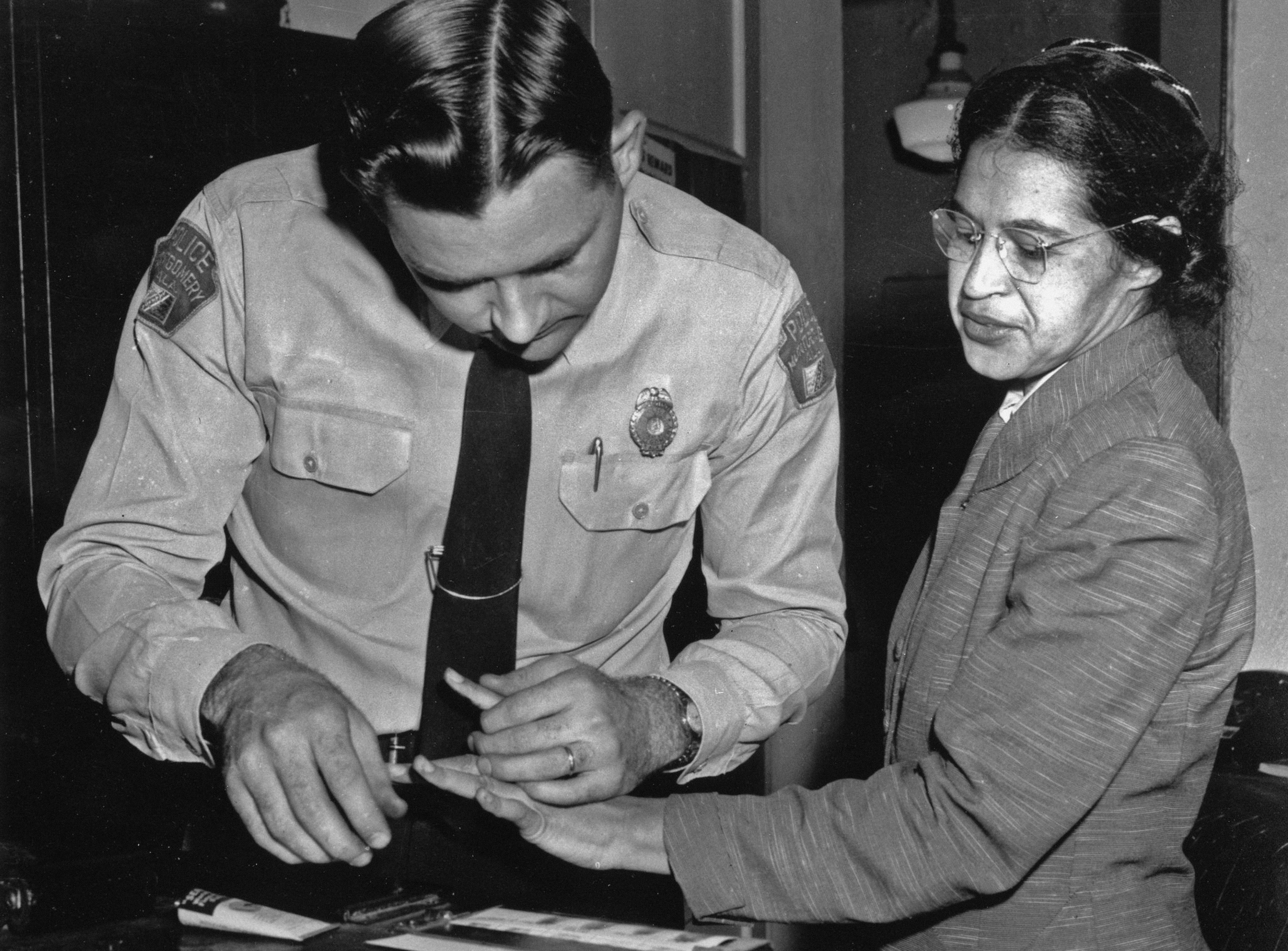 Rosa Parks is fingerprinted by police Lt. D.H. Lackey in Montgomery.