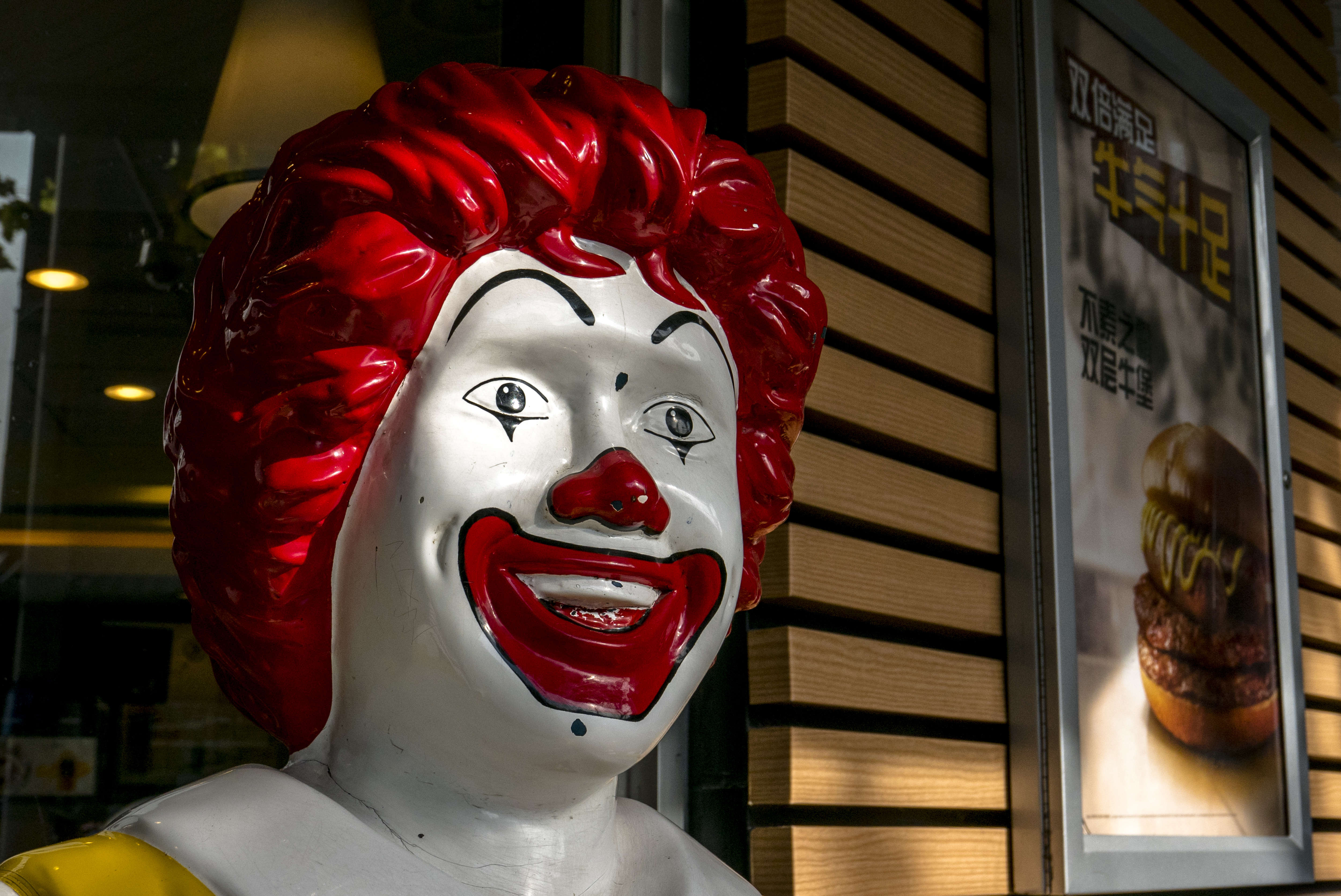 Smile face of a Ronald McDonald statue outside an McDonald's...