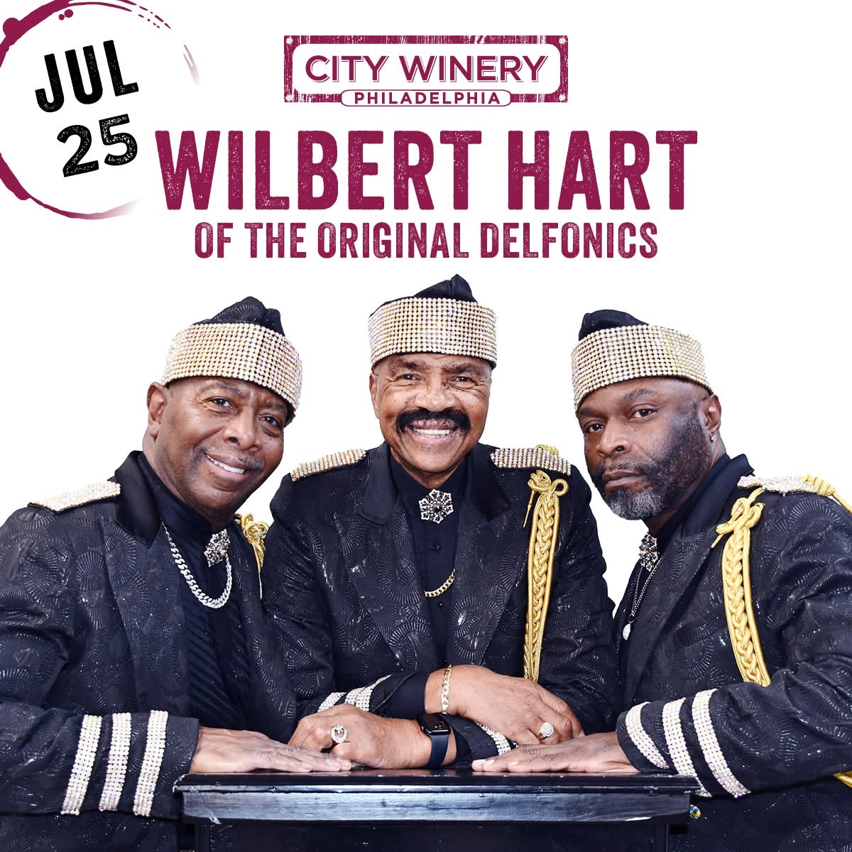 Three men in ornate black and gold outfits with bejeweled headpieces, smiling and posing together. Text reads "CITY WINERY PHILADELPHIA" and "WILBERT HART OF THE ORIGINAL DELFONICS".